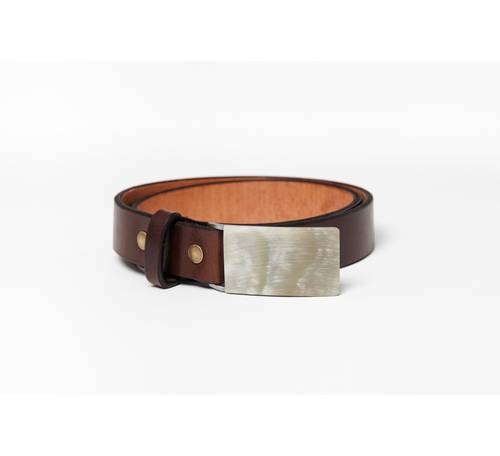 A brown leather belt with a wide, brushed silver metal and horn buckle, coiled on a clean white background.