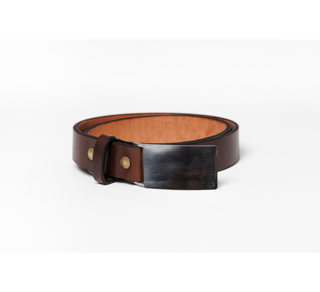 A dark brown leather belt with a wide, dark wood-grain textured rectangular buckle and brass rivets, coiled on a white background.